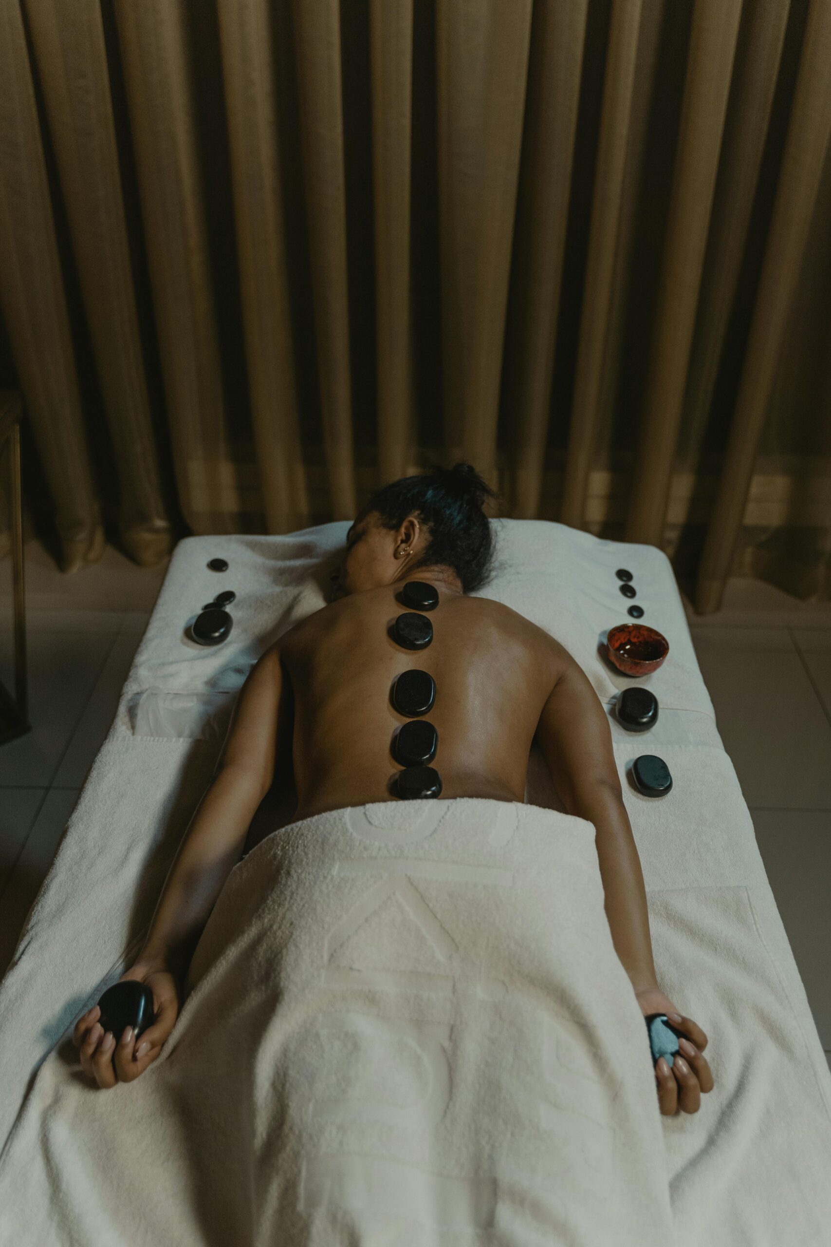 renewal and rejuvenation in luxury spa hot stone